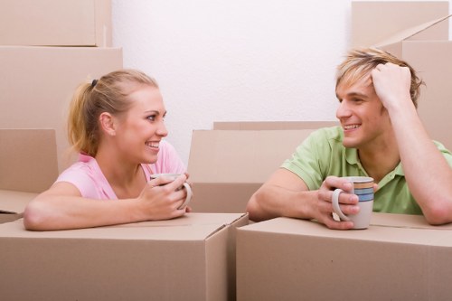 Residential building and moving boxes representing local removals in Isle of Dogs