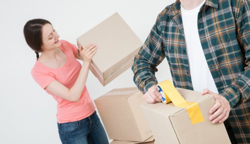 Professional movers handling furniture during an Isle of Dogs house move
